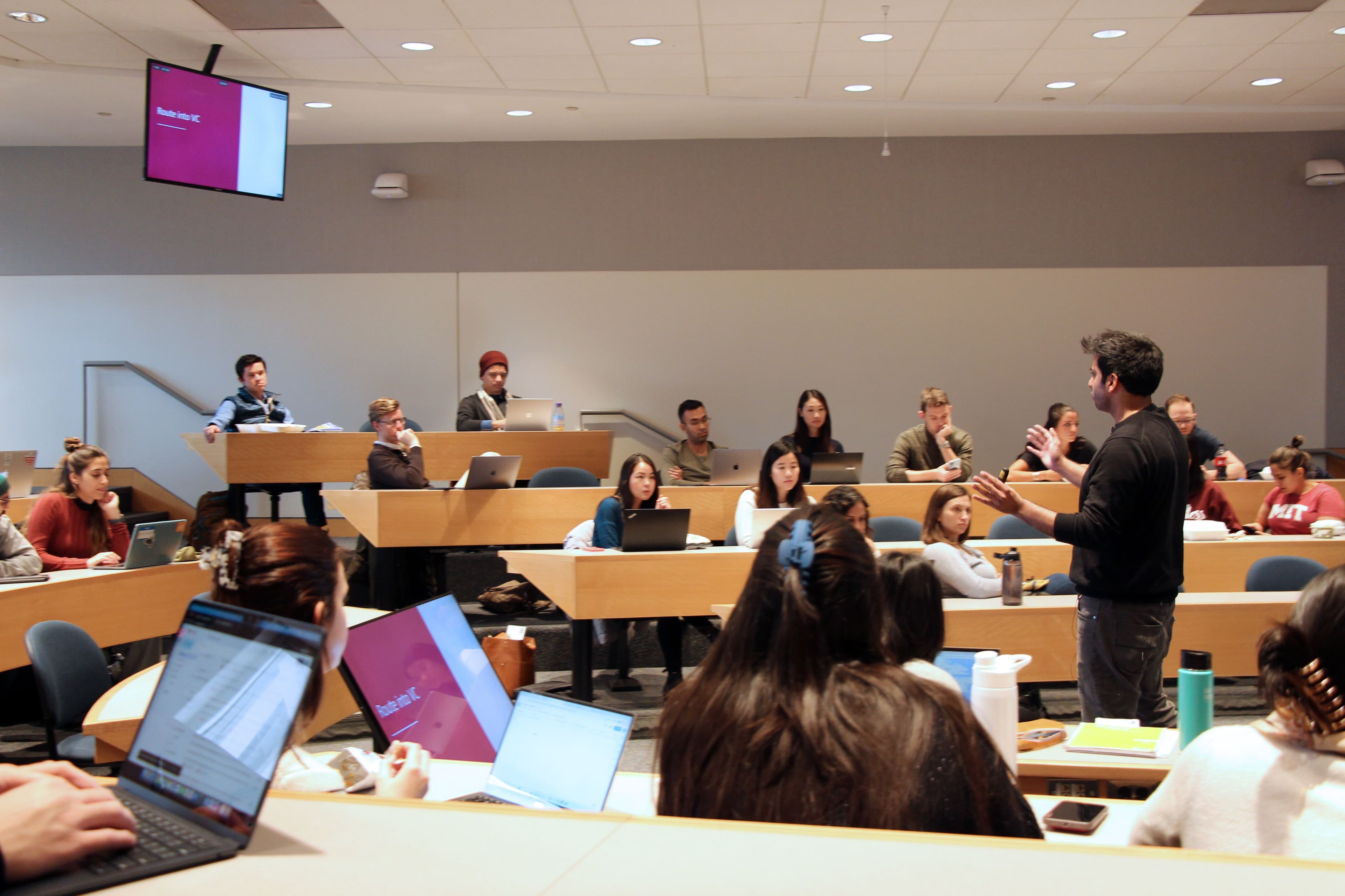 Hassan Akram speaking to a graduate audience in an MIT Sloan student-led session on routes into venture capital.